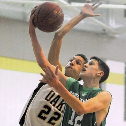 Keystone Oaks' Braydon Griffiths tries to block South Fayette's Evan Bonnaure, who paced the Lions with 29 points in the win.