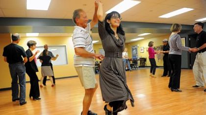 Luanne O'Brien, founder of Integral Ballroom Dance, warms up with Dennis Bradley of Murrysville.