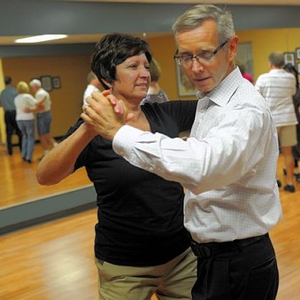Sharon Wise, left, of Greensburg dances with Joe O'Brien in a class at Integral Ballroom Dance.