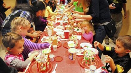 Everyone has a  personal vision of the perfect gingerbread house at the workshop at the Scott library Sunday.