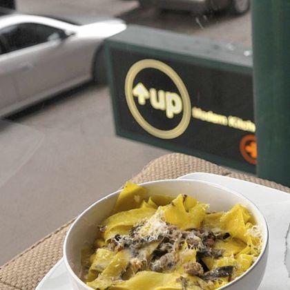 Pappardelle with sausage and greens.