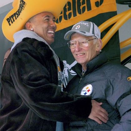 Steelers Hines Ward greets team owner Dan Rooney on the stage during a parade for the Super Bowl XL champion Pittsburgh Steelers.