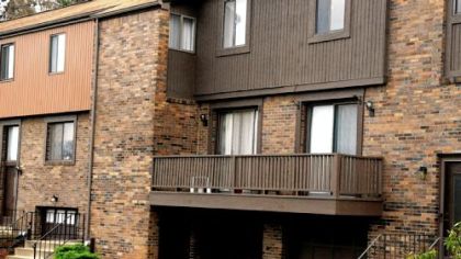 The townhouse at 102 Wallace Park Drive is at left in the unit with the deck.