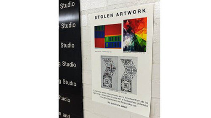 The stolen artwork poster in the student gallery at the Frick Fine Arts Building in Oakland.