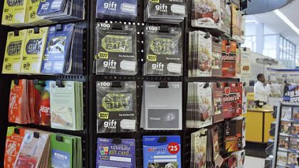 Gift cards for various retailers are offered for sale at a supermarket in Omaha, Neb.