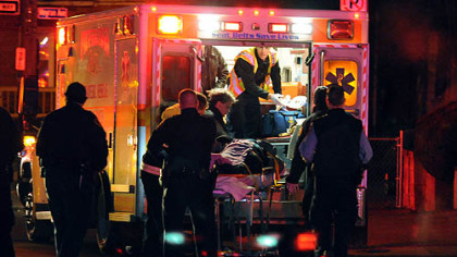 Pittsburgh medics care for an injured pedestrian on Bates Street near Atwood  in Oakland.