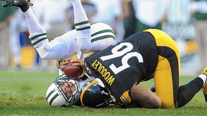 Steelers LaMarr Woodley sacks Jets quarterback Mark Sanchez.