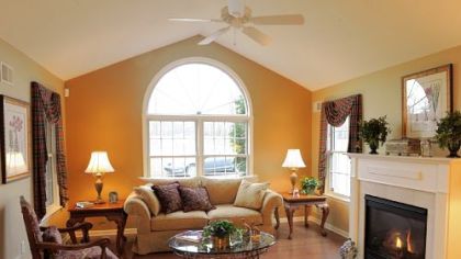 The living room has a hardwood floor, gas fireplace and vaulted ceiling.
