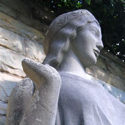 This limestone Dryad statue, which is missing a hand, was designed and sculpted in 1918 by Paul Manship.