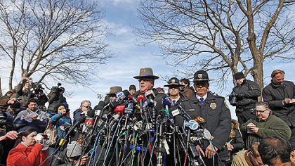 Lt. J. Paul Vance of the Connecticut State Police conducts a news briefing, this morning in Newtown, Conn. updating progress in the investigation of yesterday's massacre at the Sandy Hook Elementary School.
