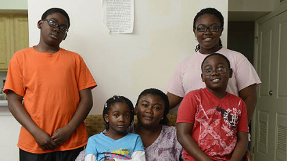 Essie Kodjo with her children, from left, Gildas, 12;  Gracia, 6; Japhet, 10; and Jisca, 14.