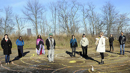 Vikki Hanchin from Swissvale and Miguel Sague from Penn Hills stand at the center of the Mayan labyrinth in Bandhi Schaum Park on the South Side Slopes. They are joined by other Mayan calendar devotees who oppose the doomsday scenarios that predict the end of the world.