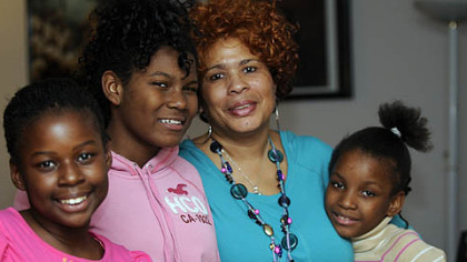 Marsha Thomas with her great-niece Nasya, 11, granddaughter Chantel, 13, and great-niece Tanoa, 9, at her home in Wilkinsburg.