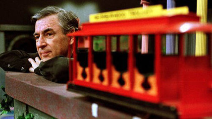 Fred Rogers pauses during a taping of his show " Mister Rogers' Neighborhood."