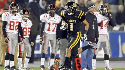 North Allegheny's Brendan Coniker returns a fumble for a touchdown as players on Coatesville sideline watch helplessly.