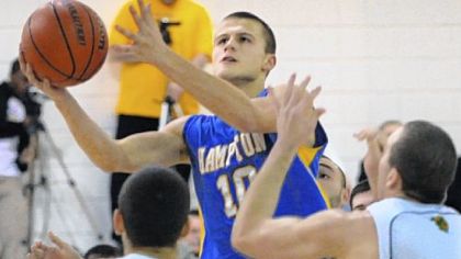 Hampton junior Ryan Luther takes it to the basket during a victory against Penn-Trafford to open the season.