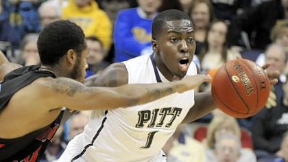 Tray Woodall steals the ball from Delaware State's Albert Thomas in the second half of Pitt's 71-43 victory Wednesday at Petersen Events Center.
