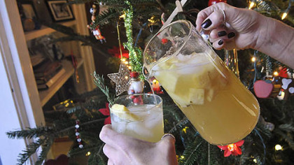 Pouring a gin punch.