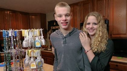 Derek Sleith and his sister, Raeann, in their home in North Huntingdon. Derek, 17, was born with Cri du Chat syndrome; his sister has raised $33,000 for charity by making bracelets.