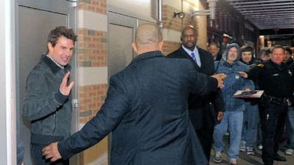 Actor Tom Cruise leaves via a side door of the SouthSide Works Cinema after introducing his new film "Jack Reacher" at a free screening.