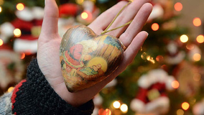 A "first Christmas" ornament Barb Albanese gave to her husband Dave. The Albanese family, of New Brighton, moved to Doha, Qatar, in 2005 but returns to Pittsburgh every year for Christmas.