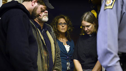 The Rev. Elizabeth Hess, right, announced a vigil to remember the victims of today's shootings, to be held at 7 p.m. Saturday at Geeseytown Lutheran Church in Blair County.