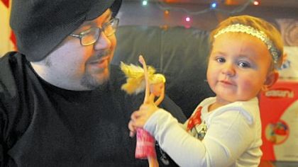 Danny Martin holds his daughter Danica.