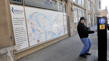 Pat Erhardt of Clairton pays for on-street parking Downtown.