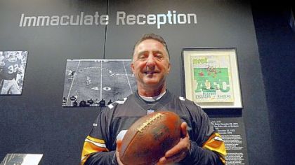 Jim Baker, who ended up with the ball from the Immaculate Reception, poses with the ball at the Heinz History Center on Friday, November 16, 2012.