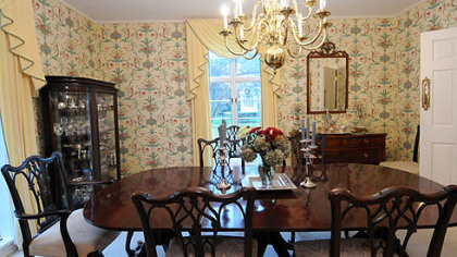 The formal dining room is awash with sun.