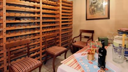 The wine cellar has rack space for 400 bottles.