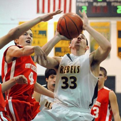 Seton-LaSalle's Luke Brumbaugh draws the defensive attention of Fort Cherry's Phil Baker in the first half Friday night at Seton-LaSalle.