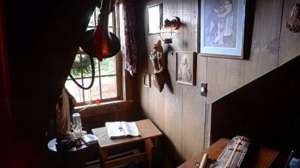 An upstairs dormer: This one is a personal chapel with a kneeler for prayer and spiritual reading.