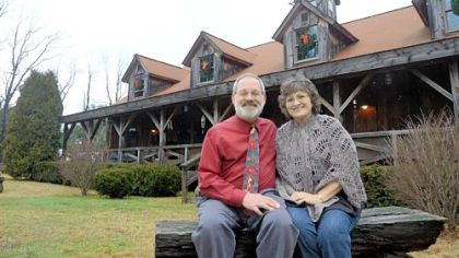 Ron and Marie Songer built their house by disassembling and rebuilding an old barn and repurposing materials from others.