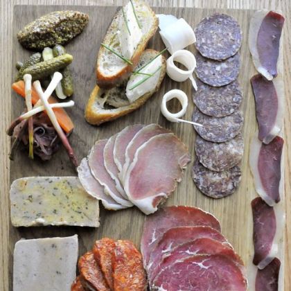 The salumi board includes terrine, duck speck, baseola, salami, chorizo and lardo.