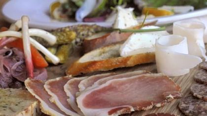The salumi board at Cure features meat cured in-house with accompaniments.