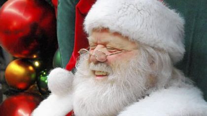 "Santa Ron" shares a laugh with children at Ross Park Mall.