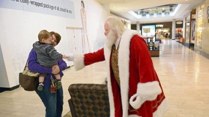 Santa Ron greets Benson, 14 months, and his mother Denise Griffith of Shaler.