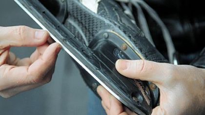 Eric Swanson shows how skate blades have a thin channel down the middle, creating distinct inside and outside edges.