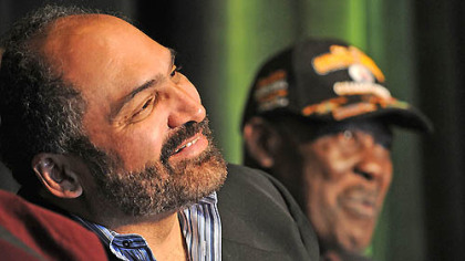 Franco Harris, left, and John "Frenchy" Fuqua listen to a story about the Immaculate Reception during an anniversary celebration Saturday at the Heinz History Center in the Strip District.