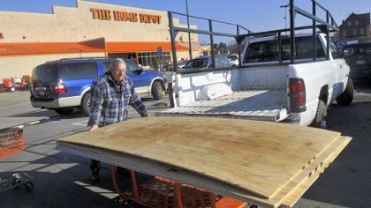 Anton Abraham of Oakland loads his truck with building supplies at Home Depot in East Liberty.