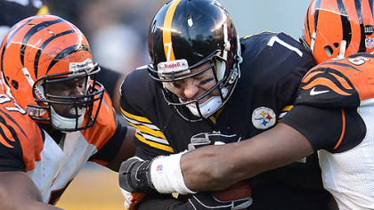 Steelers quarterback Ben Roethlisberger is sacked during Sunday's game by Bengals Geno Atkins and Carlos Dunlap.