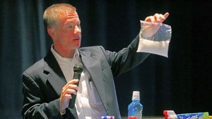 During a community meeting in August, Shell Oil process integrator and process engineer Todd Whittemore shows a bag of polyethylene resin that would be produced at a  proposed Shell cracker plant in Beaver County.