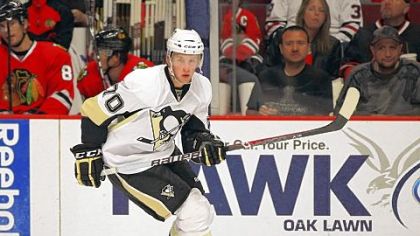 The Penguins' No. 4 prospect Joe Morrow skates up the ice against the Chicago Blackhawks in a 2011 preseason game.