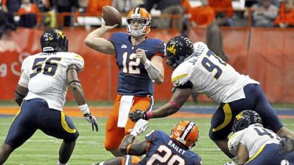 Syracuse quarterback Ryan Nassib (12) threw for 229 yards and four touchdowns as the Orange beat West Virginia, 49-23, last season.