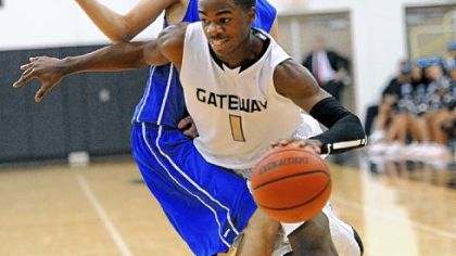 Gateway's Jordan Landfair drives around Woodland Hills' Brian Baker during a Section 2-AAAA game last week.