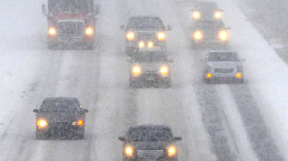 Interstate 79 southbound traffic creeps along in near white-out conditions at the Wexford interchange late this morning. Snow was falling at more than an inch an hour.