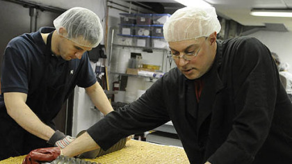 April: Operations manager Conor Foley helps production manager Greg Muckle with a batch of almond butter toffee at the Edward Marc Chocolatier shop in Trafford.