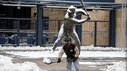 Pittsburgh Pirates staffer Hank Robinson clears snow Thursday outside of PNC Park.