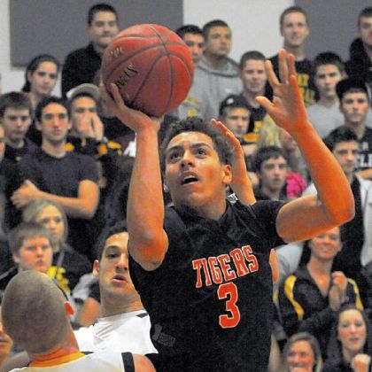 Elijah Cottrill of Beaver Falls drives toward the basket against Montour Thursday at Montour.